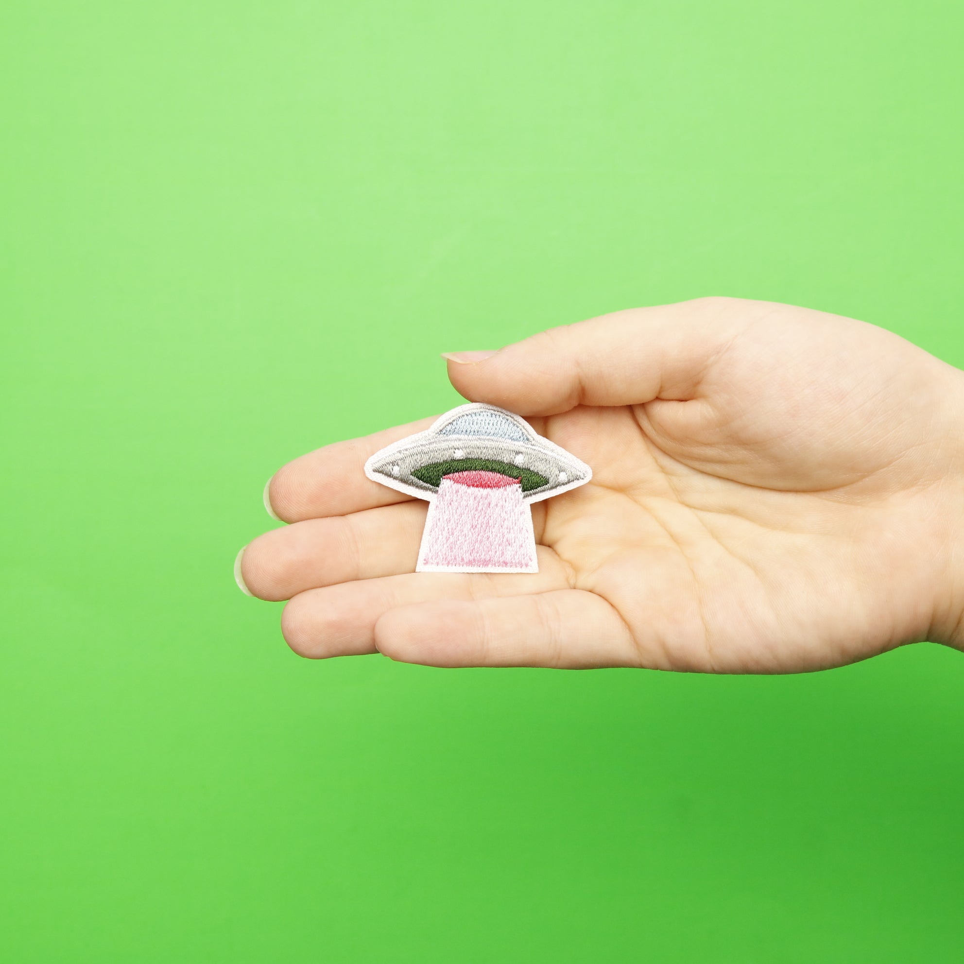 Small Grey UFO With Pink Abduction Ray Embroidered Iron On Patch