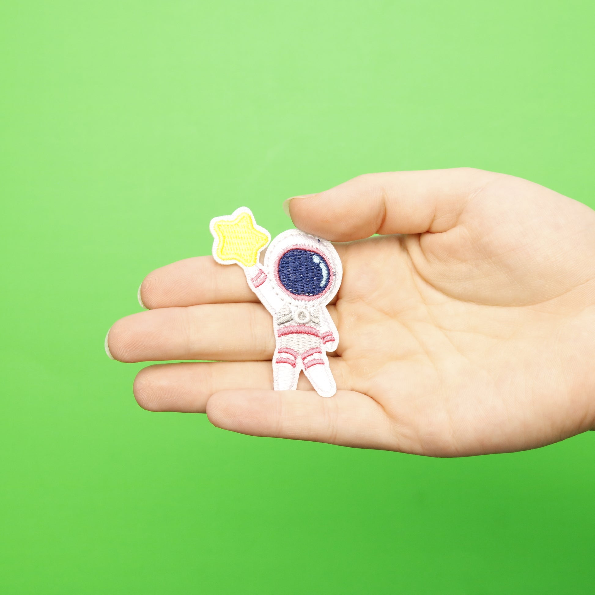 Small Pink Astronaut Holding A Star Embroidered Iron On Patch
