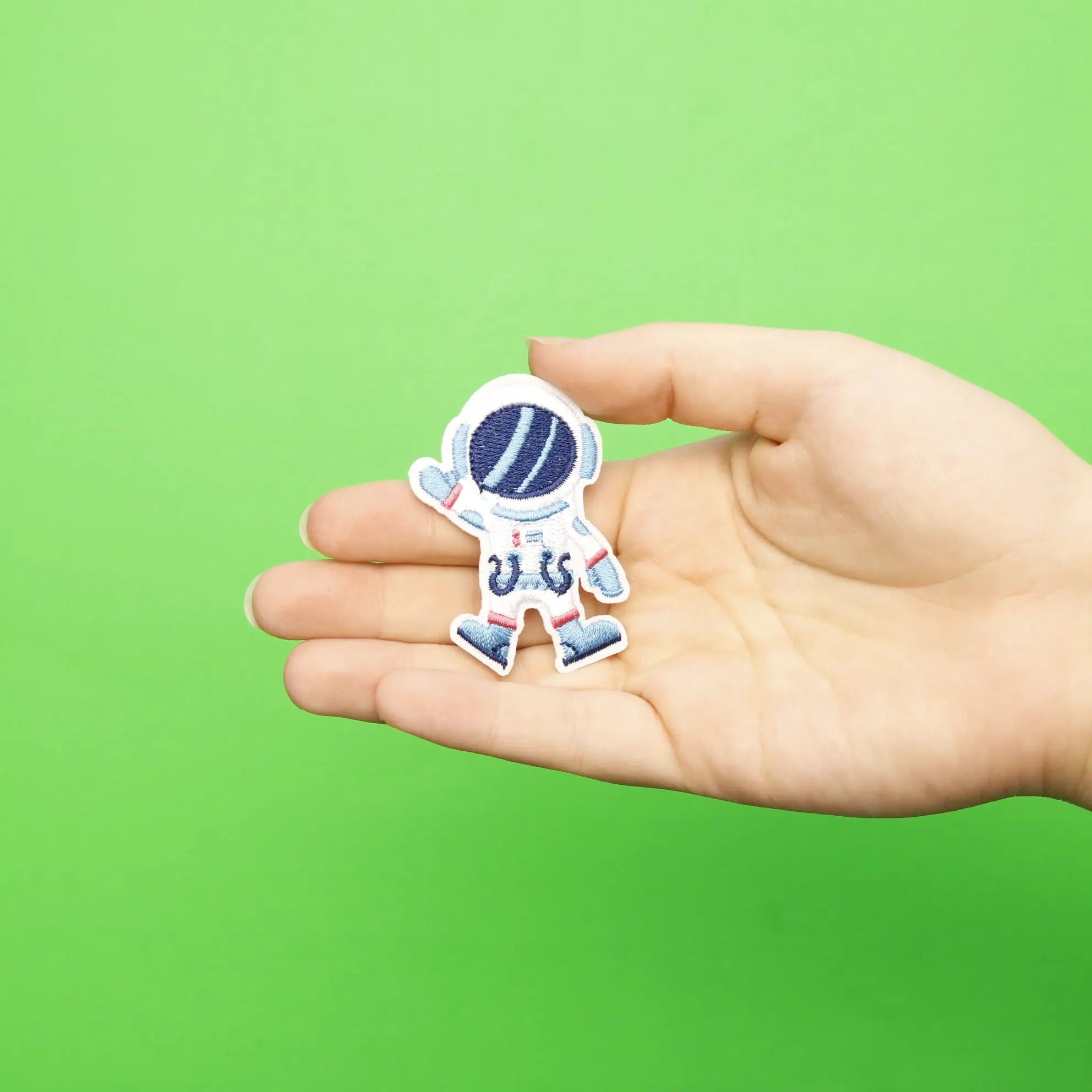 Small Blue Astronaut Waving Embroidered Iron On Patch