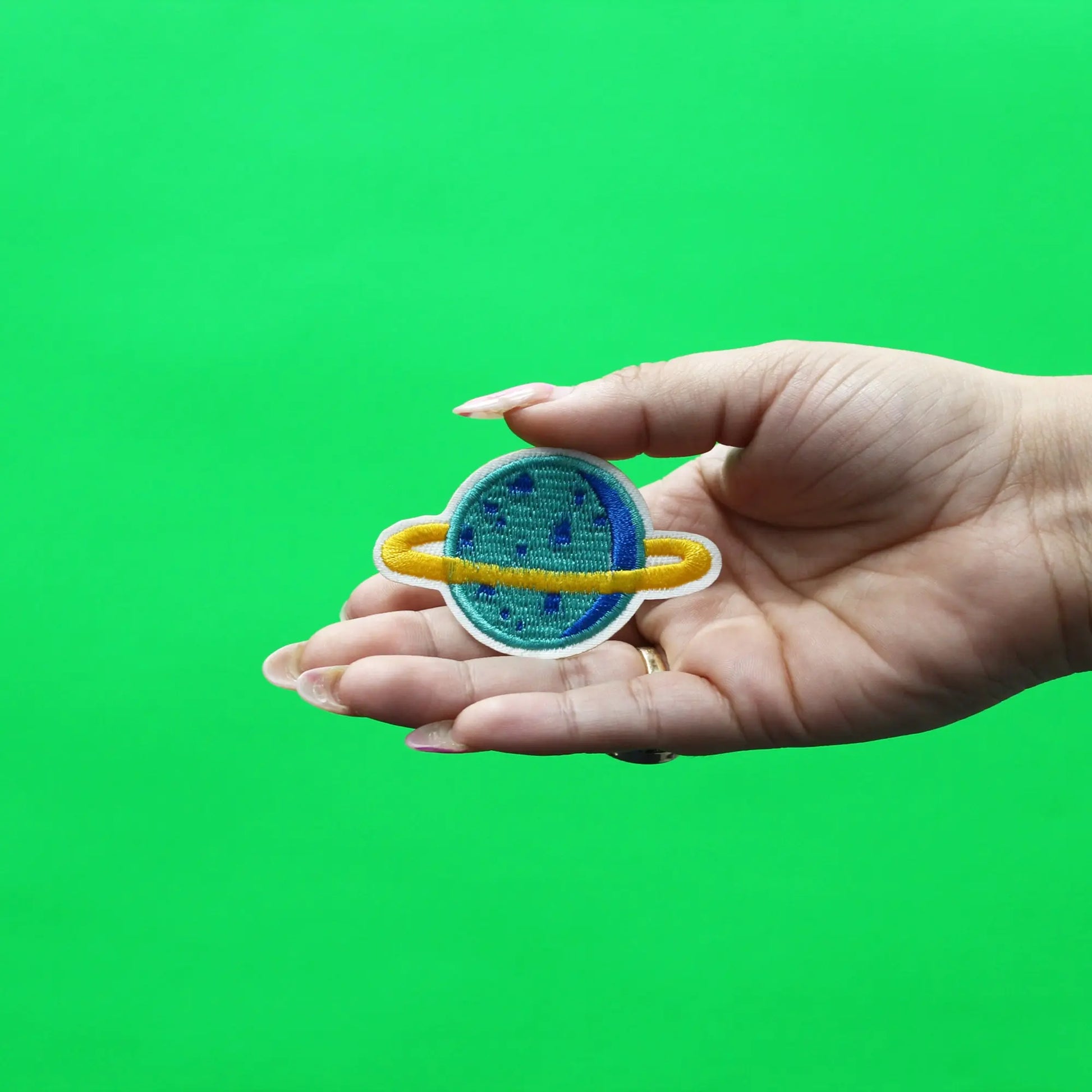 Small Teal Planet With Gold Ring Embroidered Iron On Patch