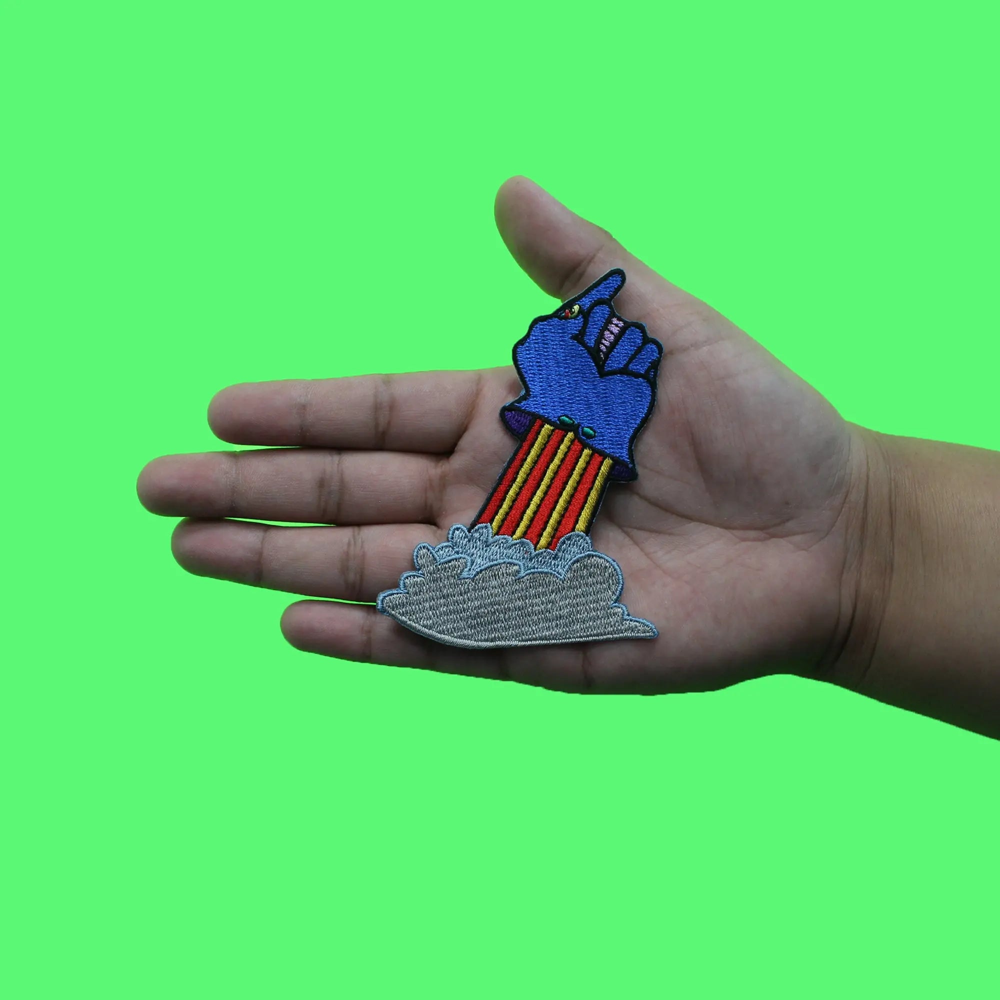 Patch brodé à repasser représentant un groupe de rock britannique des Beatles pointant une fusée